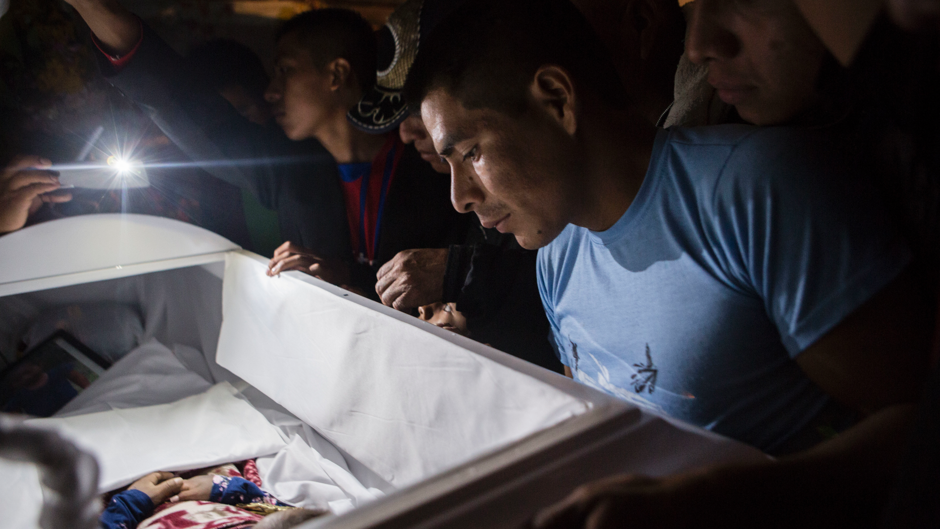 Family members pay tribute to seven-year-old Jakelin Caal Maquin during a memorial service at her grandparents' home in San Antonio Secortez, Guatemala, Monday, December 24, 2018. The body of the 7-year-old man A girl who died in the care of the US Border Patrol was handed over to family members on Monday in her homeland Guatemala for the last farewell. (AP Photo / Oliver de Ros)